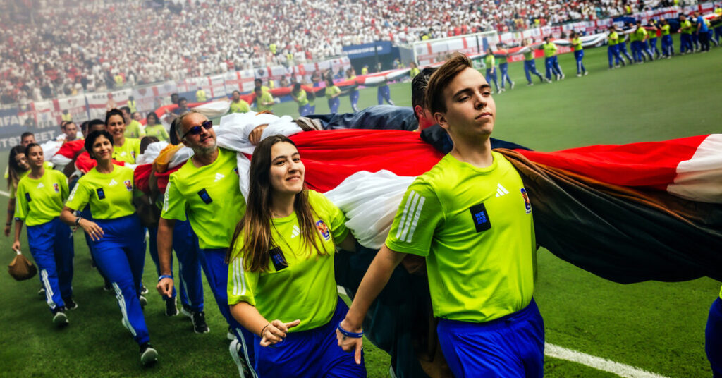 It Takes Coordination (and Many Arms) to Unfurl a World Cup Flag