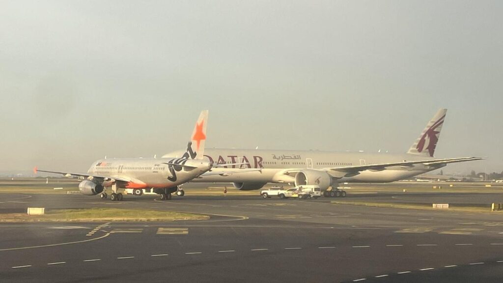 Jetstar crew member injured after Sydney Airport plane near-miss